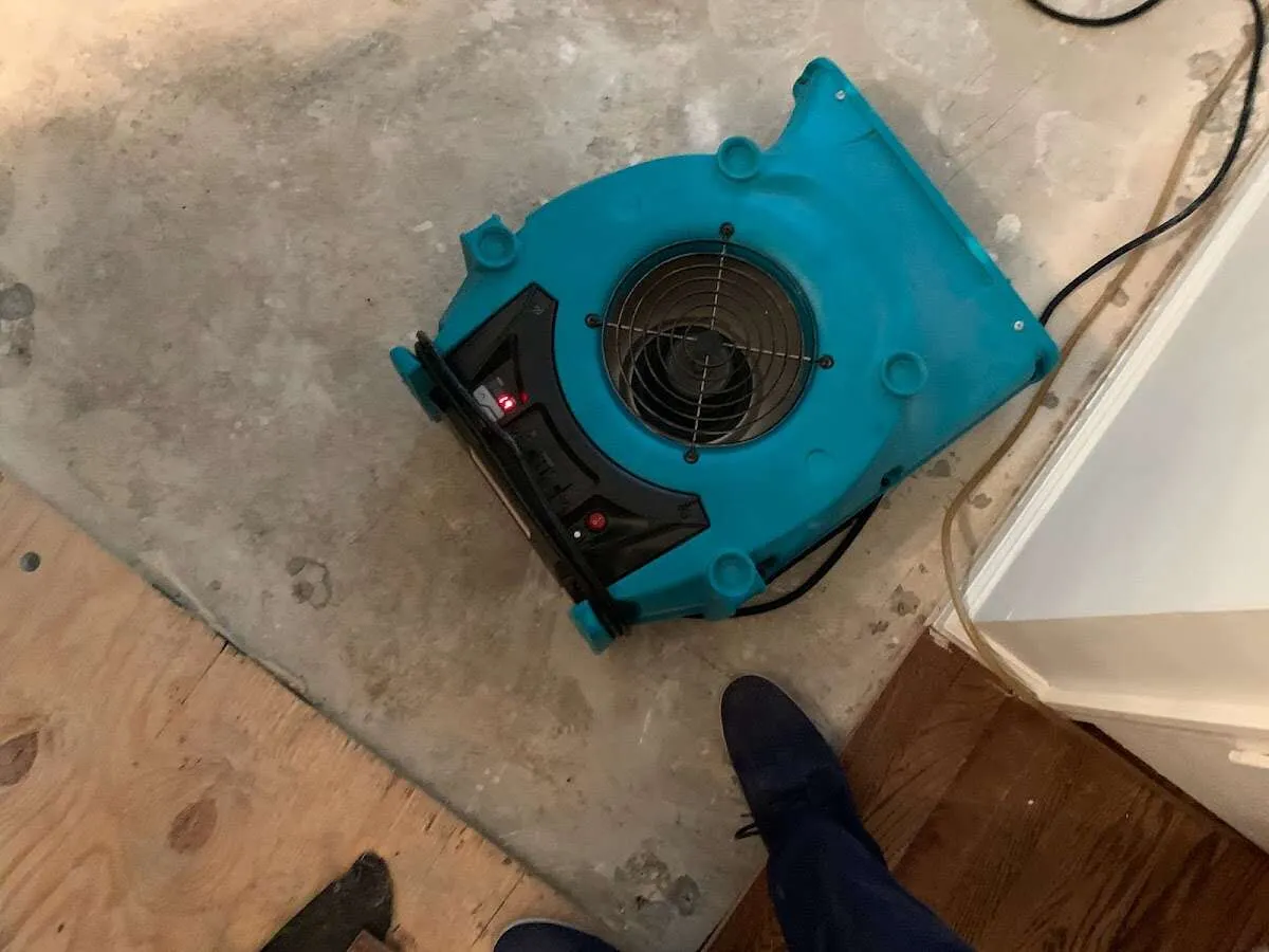 Air mover drying subfloor during Commercial Water Damage Restoration in Wichita Falls
